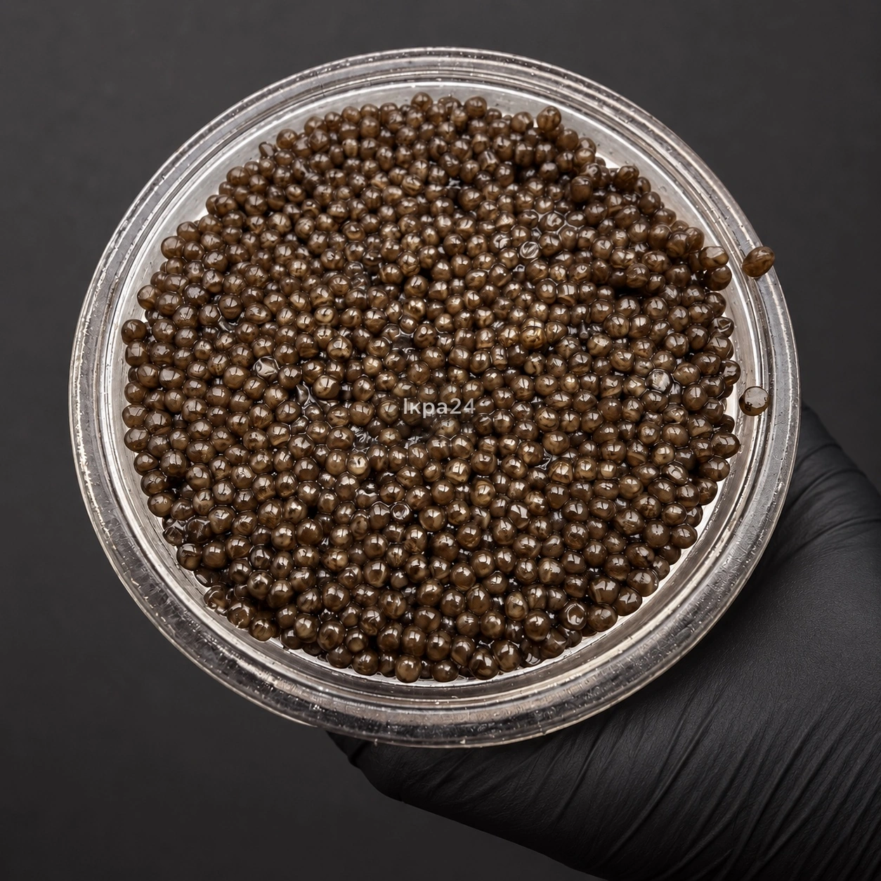 Відкрита банка ікри сибірського осетра CAVIAR HUB, вигляд зерна зверху